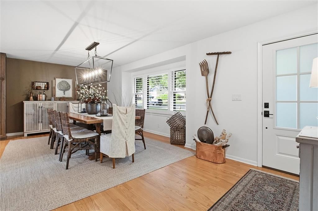 Statement lighting, white trim and accent wall at 9815 Howe Drive, Overland Park, KS 66206