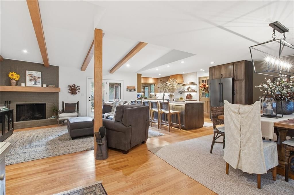 Open floor plan, hardwood floors and ceiling beams at 9815 Howe Drive, Overland Park, KS 66206