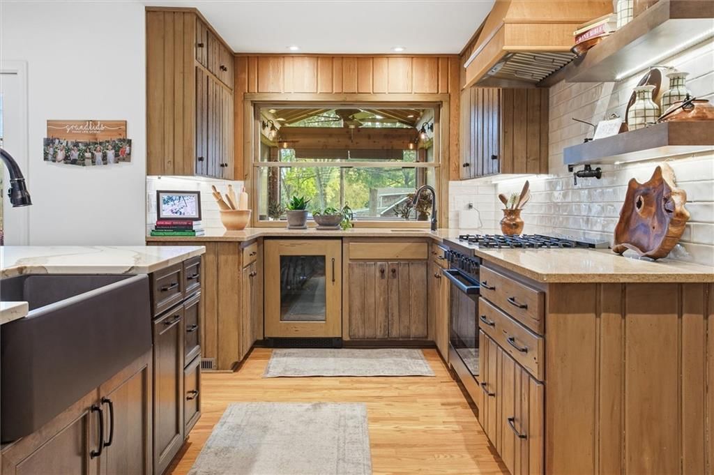 Gas range, kitchen backsplash and subway tile backsplash at 9815 Howe Drive, Overland Park, KS 66206