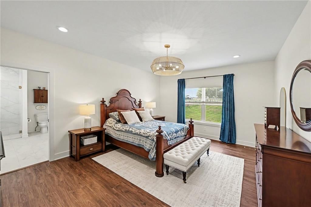 Main-floor primary bedroom at 19920 NE F Highway, Smithville, MO 64089