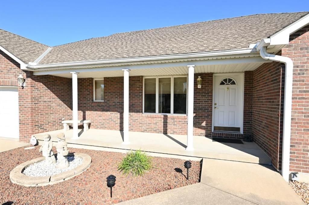 Covered front porch at 14 Pine View Road, Platte City, MO 64079