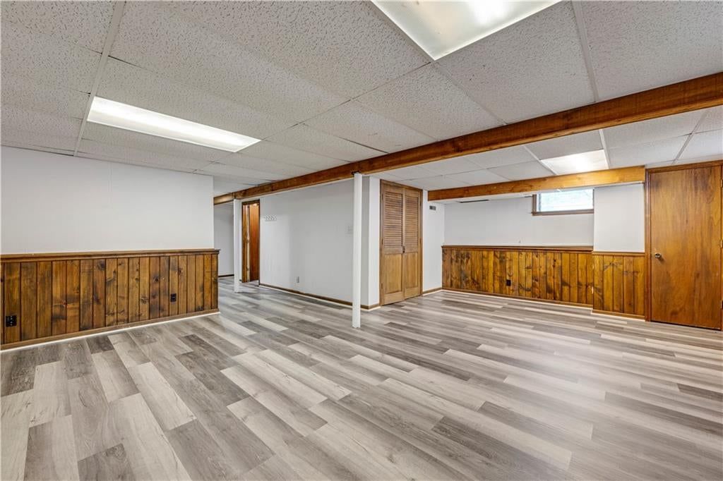 Finished basement, wainscoting or board and batten and ceiling beams at 10130 Horton Drive, Overland Park, KS 66207