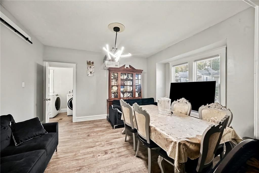 Open floor plan, hardwood floors and statement lighting at 801 N 11th Street, Kansas City, KS 66102