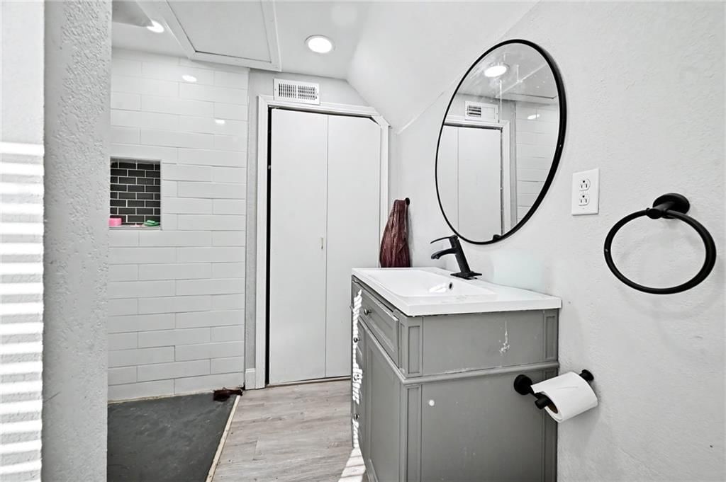Tiled shower, double vanity and frameless glass shower at 801 N 11th Street, Kansas City, KS 66102
