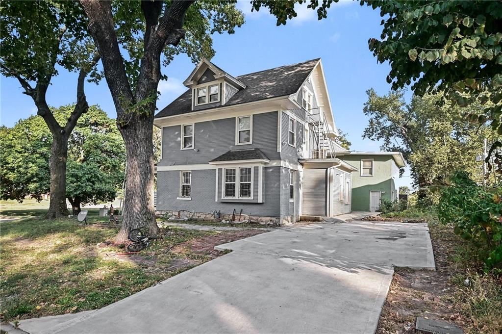 Colonial style, attached garage and concrete driveway at 801 N 11th Street, Kansas City, KS 66102