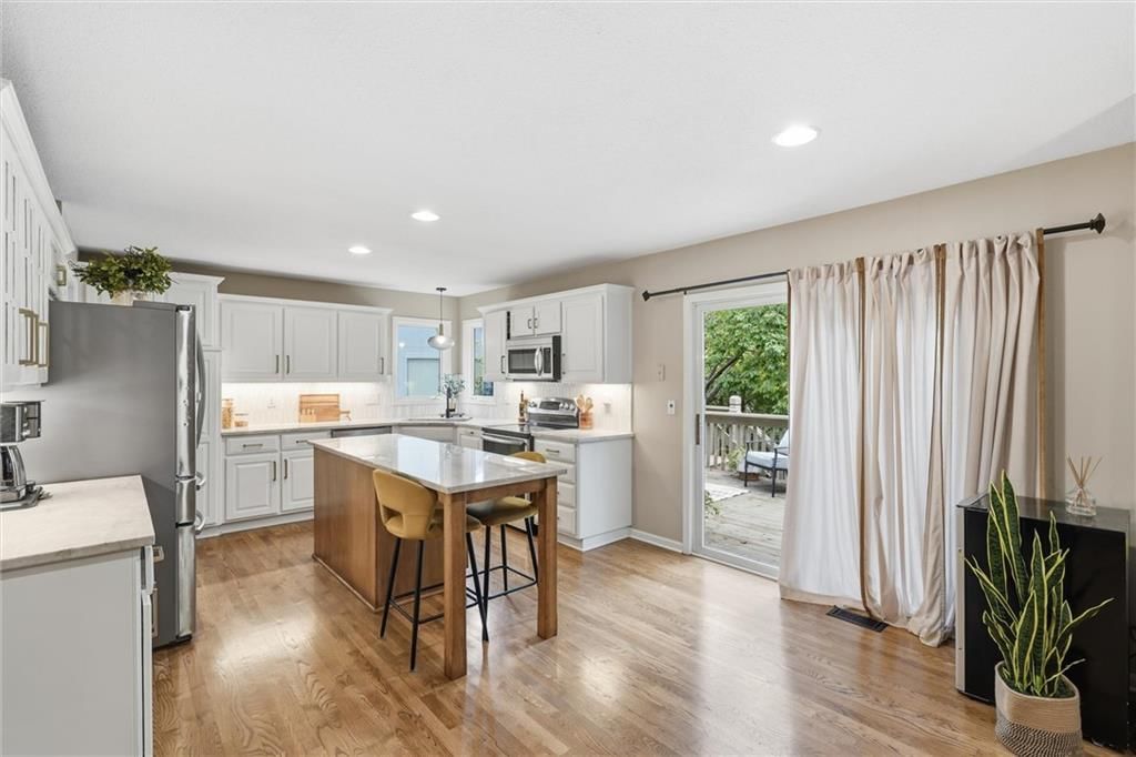 Photo 7: white kitchen cabinets, 12983 S Hagan Street, Olathe, KS 66062