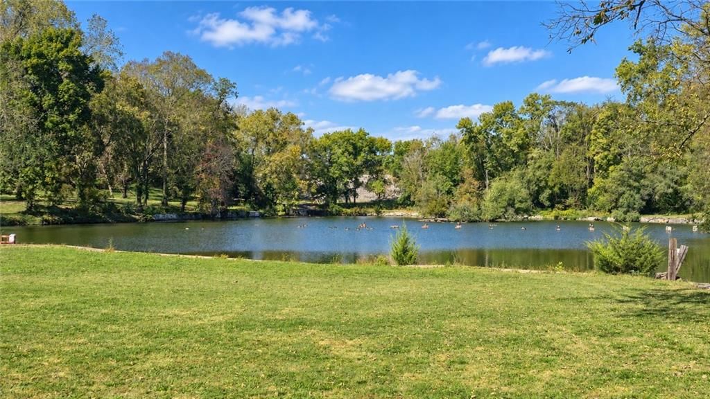 Lake visible from the property, pond or creek visible on the lot and big backyard at 6916 Wildwood Drive, Raytown, MO 64133