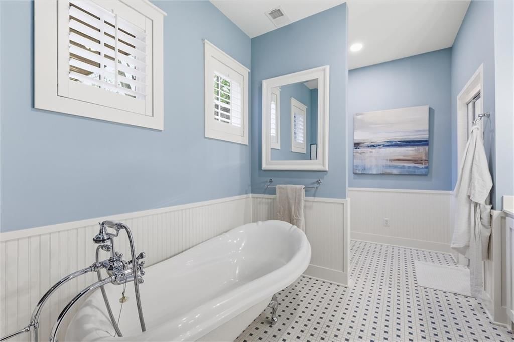 Wainscoting or board and batten and freestanding tub at 43 L Street, Lake Lotawana, MO 64086