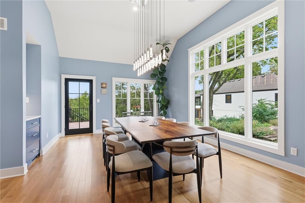 Statement lighting and wall of windows at 43 L Street, Lake Lotawana, MO 64086