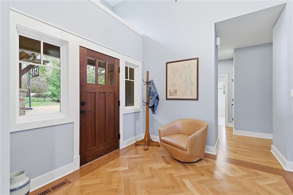 Hardwood floors, white trim and blue main wall color at 43 L Street, Lake Lotawana, MO 64086
