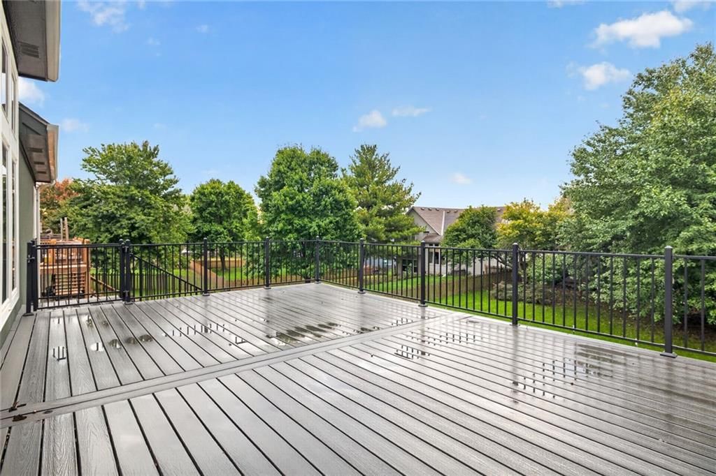 Deck, big backyard and fenced yard at 413 Shannon Avenue, Smithville, MO 64089