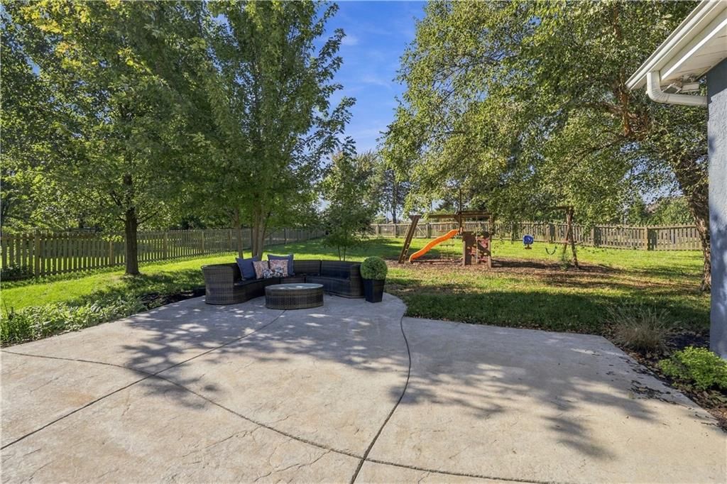Big backyard, fenced yard and mature trees at 8517 W 145th Terrace, Overland Park, KS 66223
