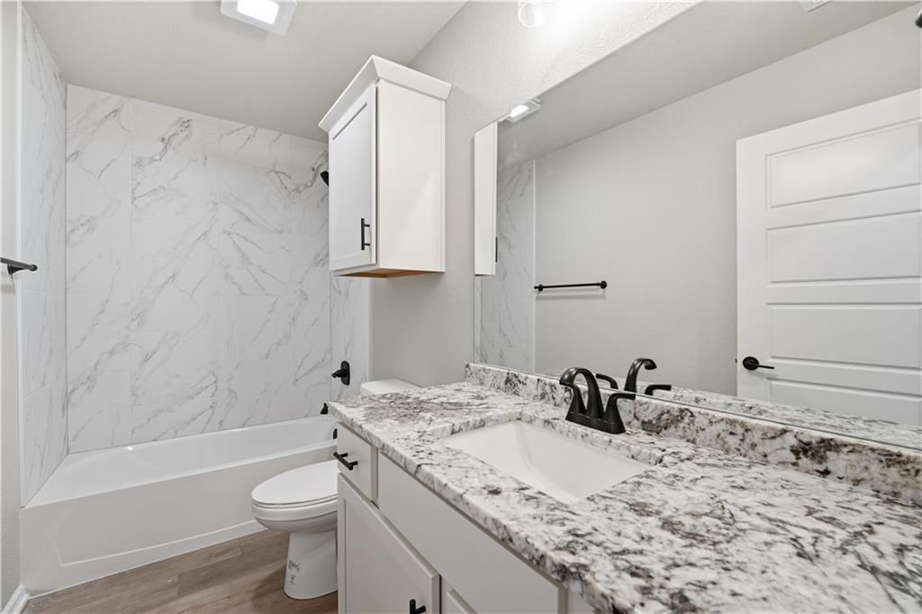Double vanity, white vanity and renovated bathrooms at 18450 W 195th Street, Spring Hill, KS 66083