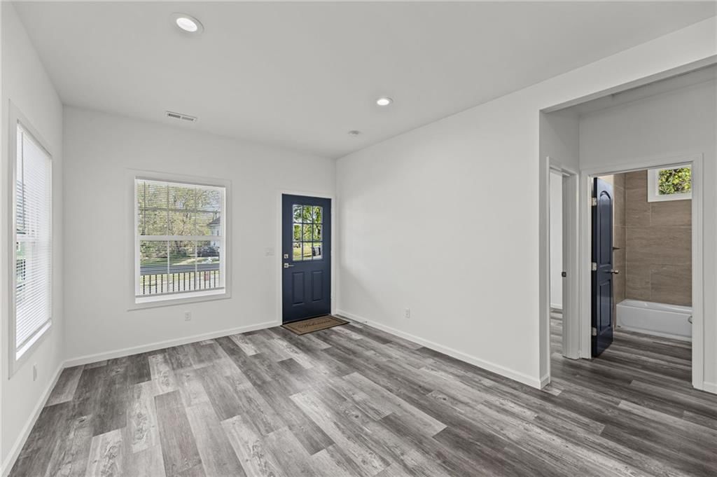 Recessed lighting, white trim and white walls at 1111 Kimball Avenue, Kansas City, KS 66104