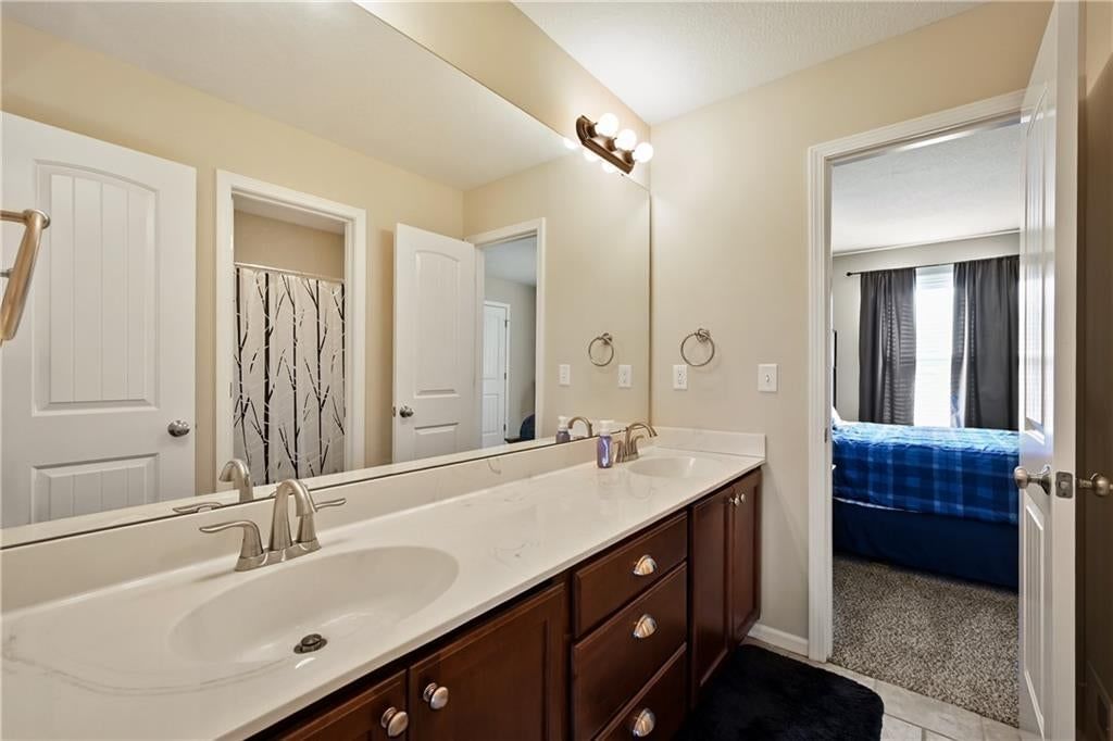 Renovated bathrooms and tub and shower combo at 3317 SW Longview Road, Lee's Summit, MO 64081