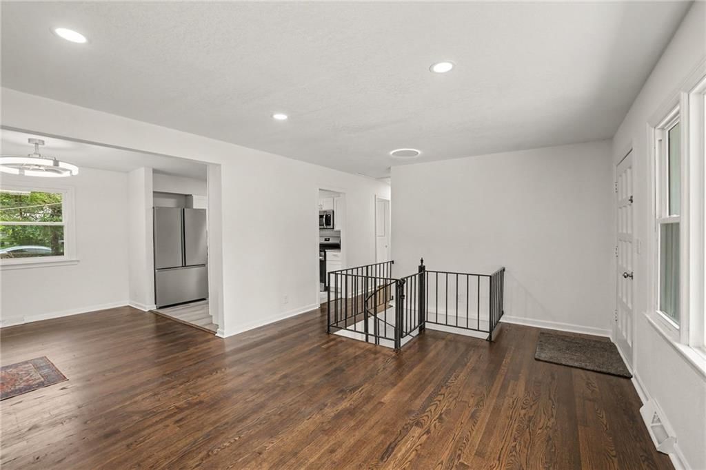 Hardwood floors, recessed lighting and white trim at 8507 Kentucky Avenue, Raytown, MO 64138