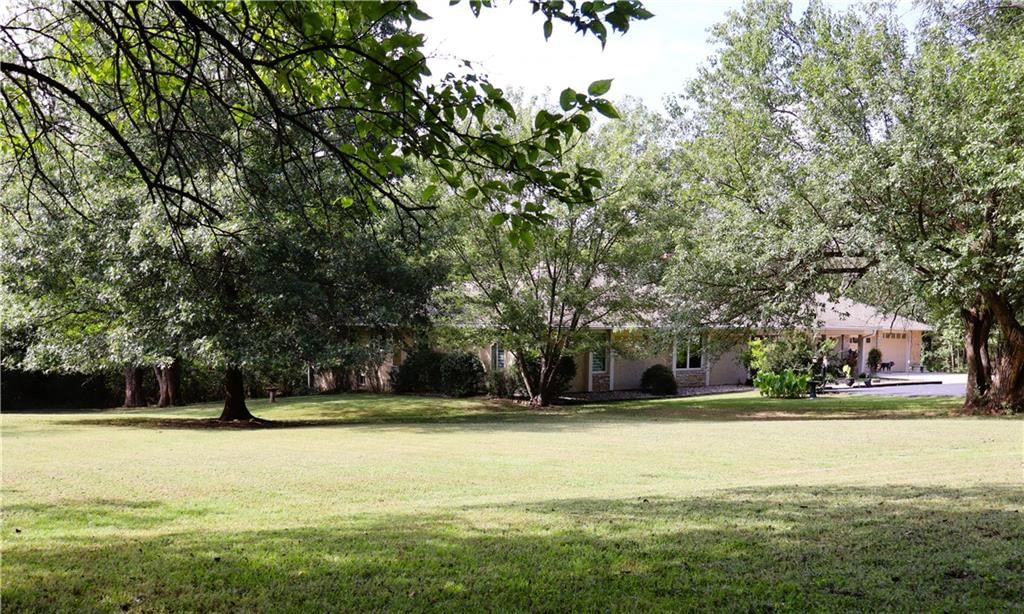 Big backyard, mature trees and flat lot at 12580 S Red Bird Lane, Olathe, KS 66061