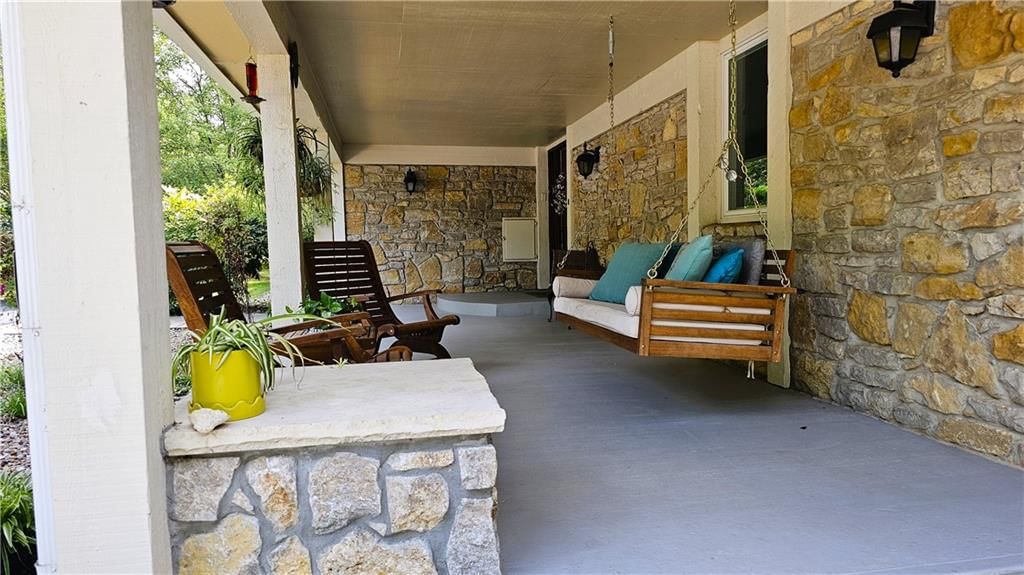 Covered front porch at 12580 S Red Bird Lane, Olathe, KS 66061