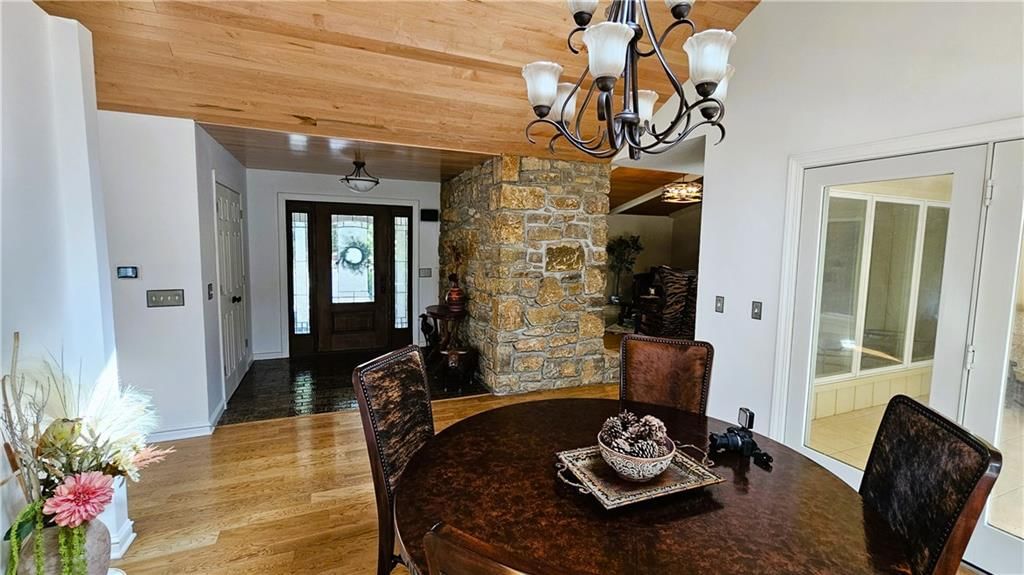 Statement lighting, breakfast nook and white trim at 12580 S Red Bird Lane, Olathe, KS 66061