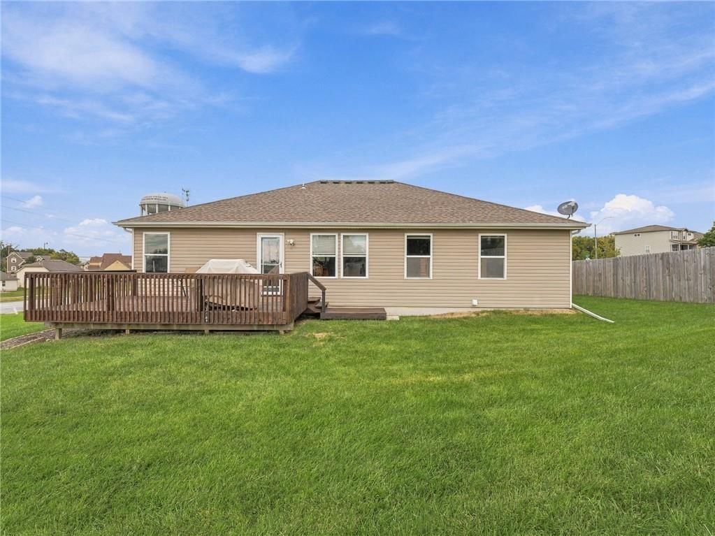 Deck, big backyard and fenced yard at 7305 E 143rd Street, Grandview, MO 64030