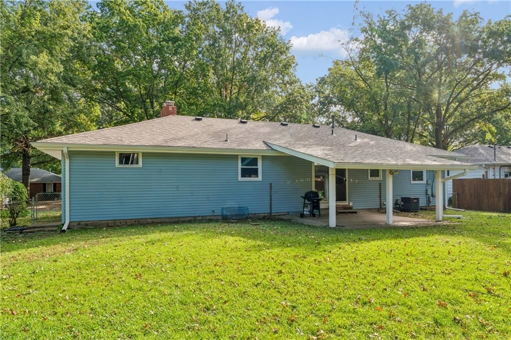 Covered patio and concrete patio at 6808 Larsen Lane, Shawnee, KS 66203