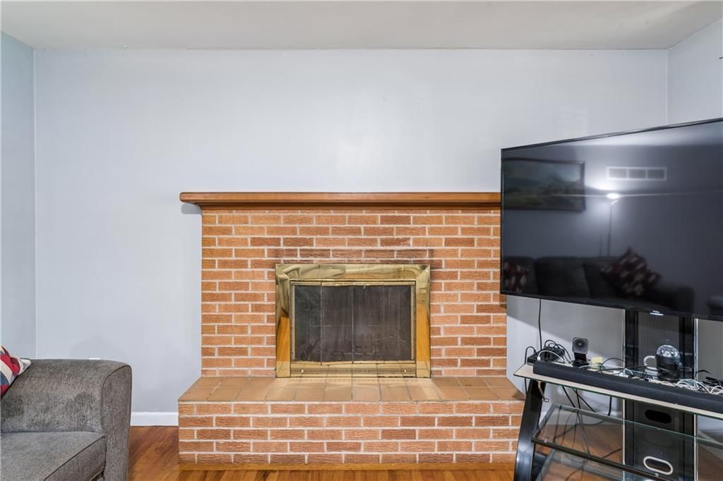 Fireplace and brick fireplace at 6808 Larsen Lane, Shawnee, KS 66203