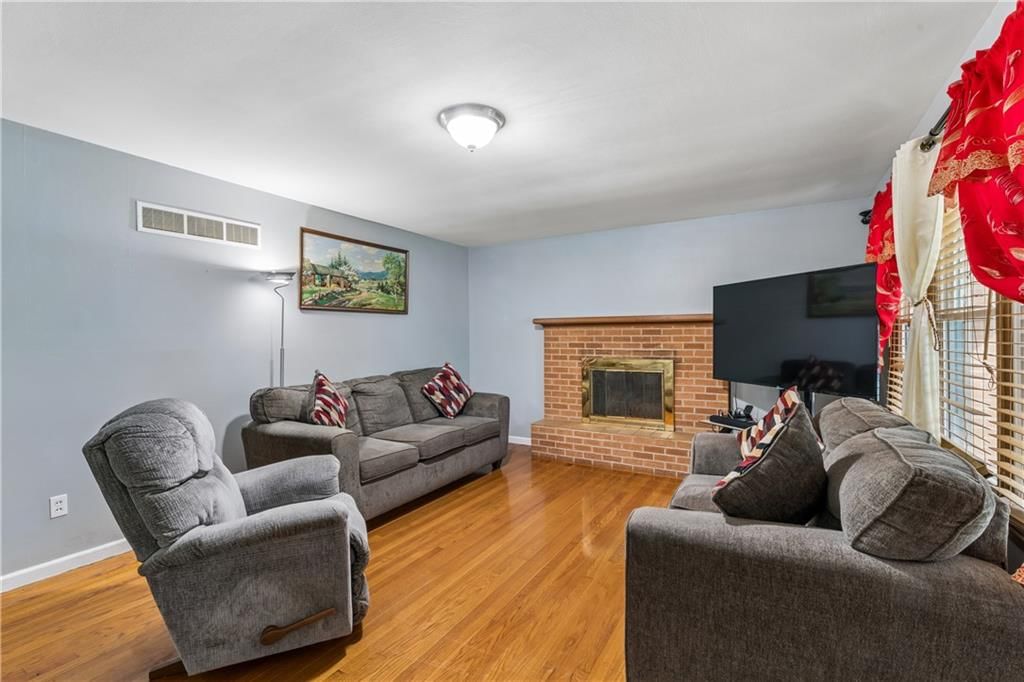 Hardwood floors, white trim and gray walls at 6808 Larsen Lane, Shawnee, KS 66203
