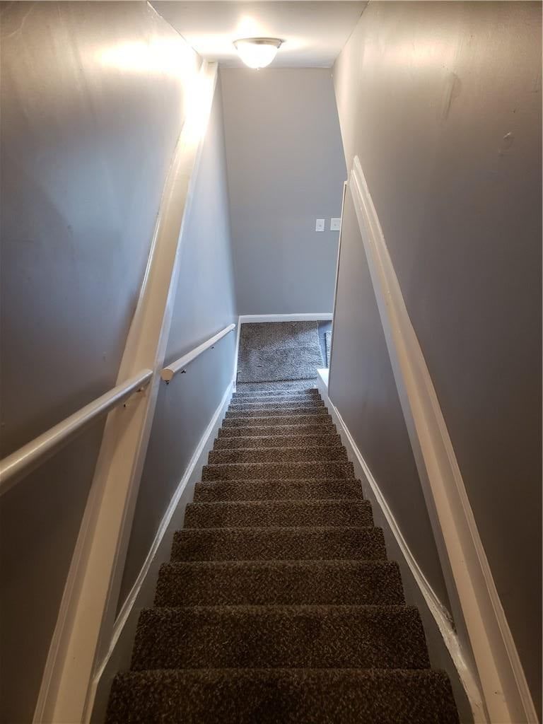 Staircase and wood stair railing at 5737 INDIANA Avenue, Kansas City, MO 64130