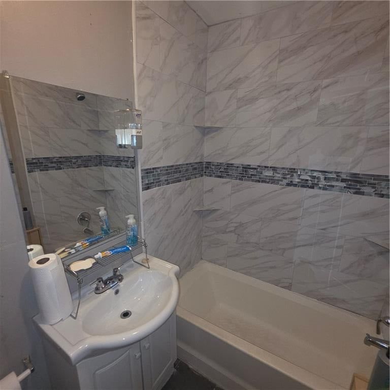 White vanity and renovated bathrooms at 5737 INDIANA Avenue, Kansas City, MO 64130