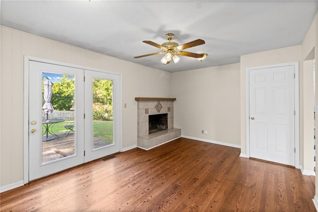 Fireplace, floor-to-ceiling windows and stone fireplace at 7512 N Baltimore Avenue, Gladstone, MO 64118