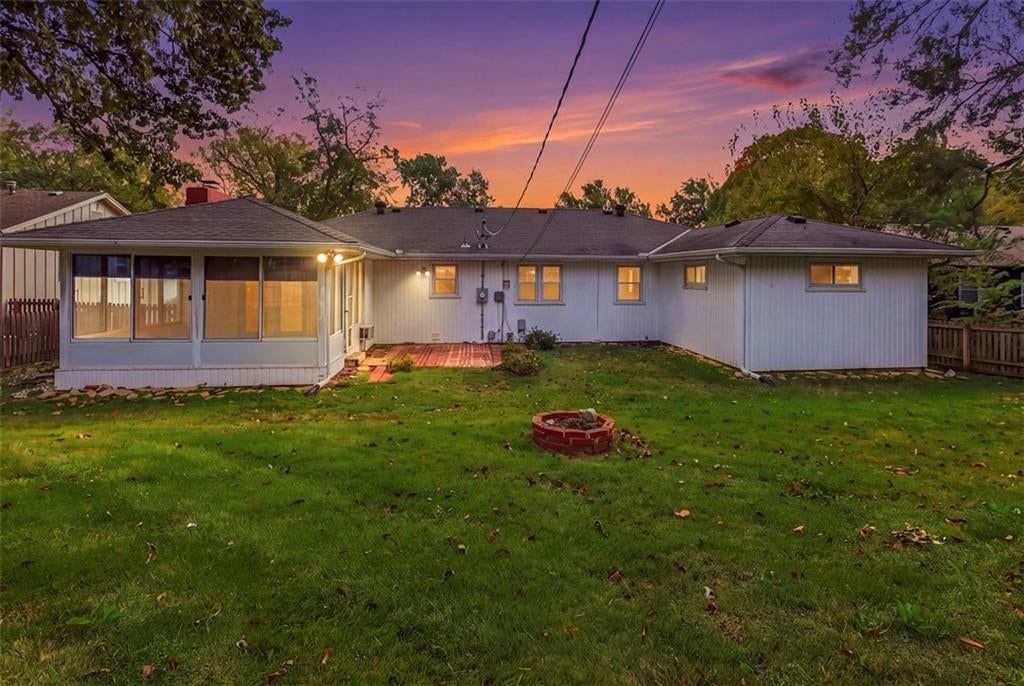 Big backyard, fire pit and screened porch at 8914 Park Street, Lenexa, KS 66215
