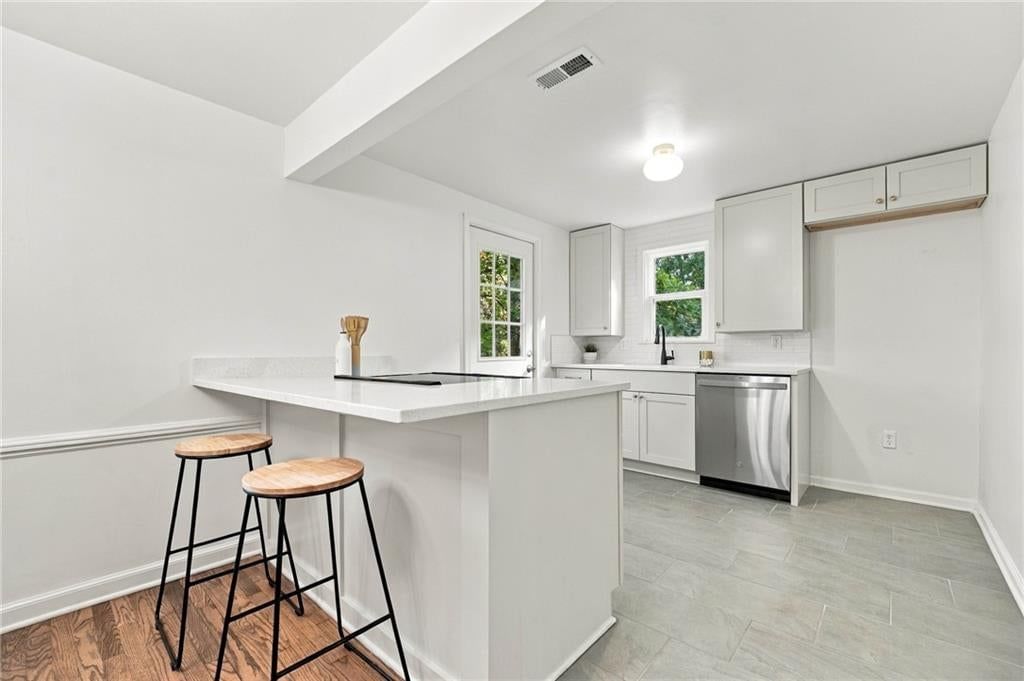 Kitchen island and stainless steel appliances at 7929 Madison Avenue, Kansas City, MO 64114