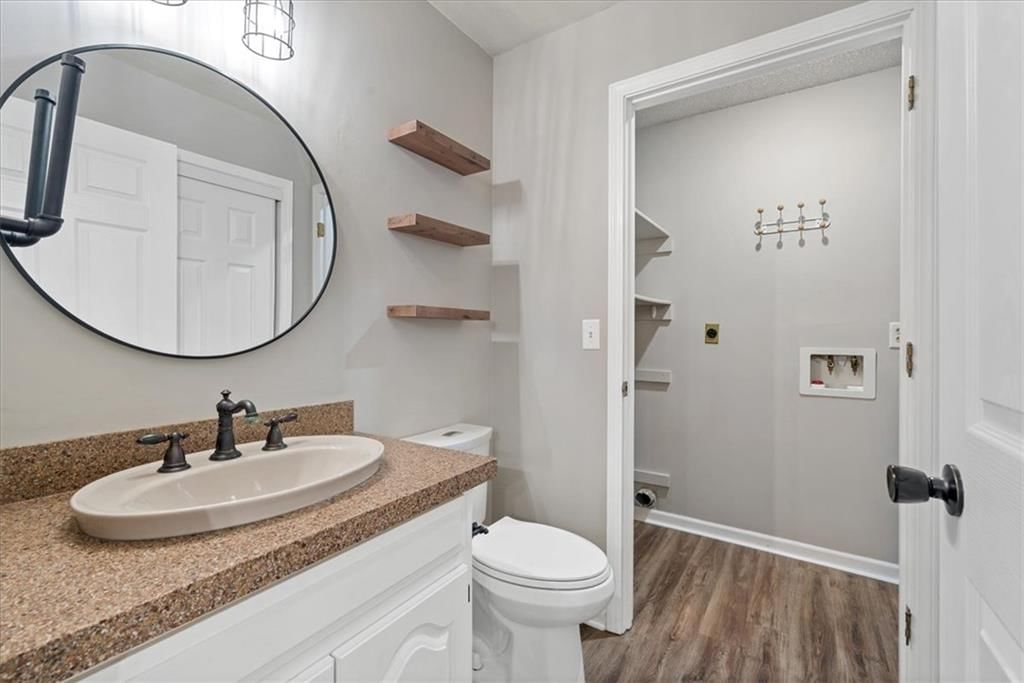 Double vanity, blue vanity and renovated bathrooms at 1425 N Hunter Drive, Olathe, KS 66061