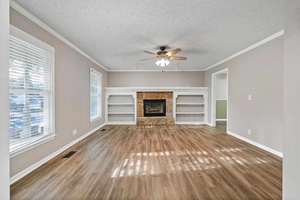 Hardwood floors, built-ins and white trim at 1425 N Hunter Drive, Olathe, KS 66061