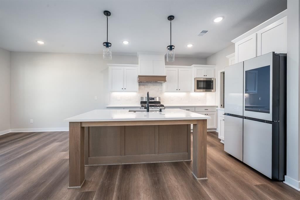 Black stainless appliances and black hardware at 14617 Aspen Circle, Basehor, KS 66007
