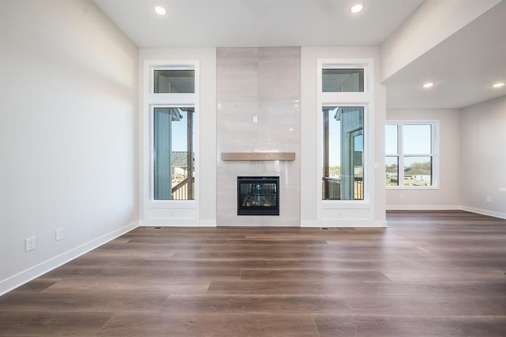 Fireplace, hardwood floors and tile fireplace at 14617 Aspen Circle, Basehor, KS 66007
