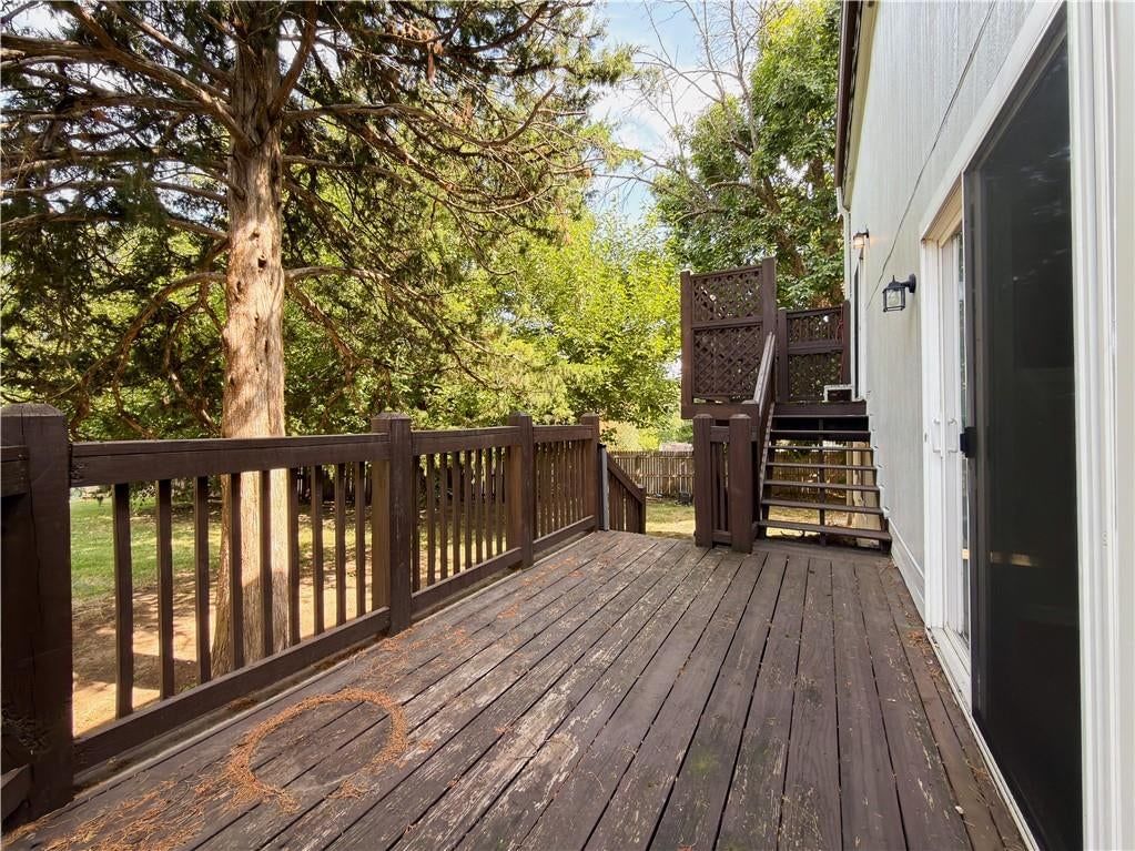 Deck, mature trees and wood deck at 11915 W 66th Terrace, Shawnee, KS 66216