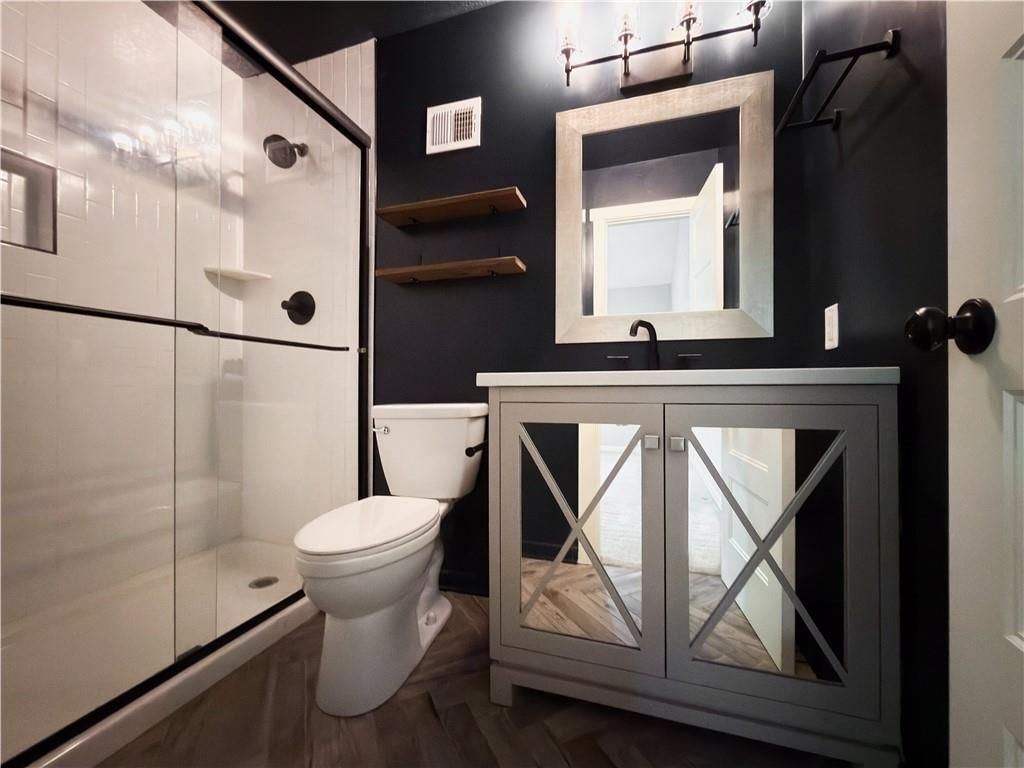 Tiled shower and renovated bathrooms at 11915 W 66th Terrace, Shawnee, KS 66216