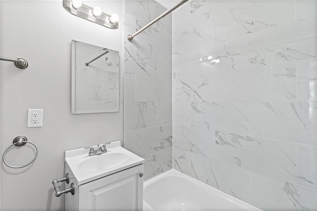 Tiled shower at 10213 E 71st Terrace, Raytown, MO 64133