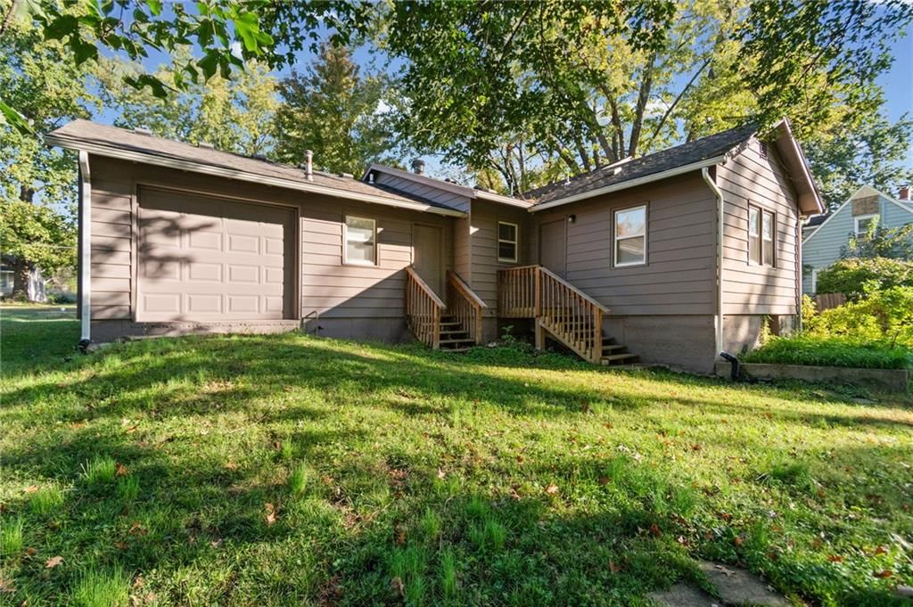 Fenced yard, mature trees and flat lot at 10213 E 71st Terrace, Raytown, MO 64133