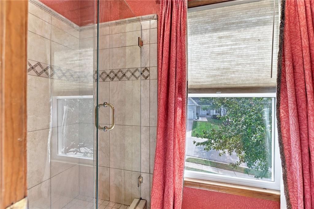 Walk-in shower and frameless glass shower at 17612 E 48th Terrace Court S, Independence, MO 64055