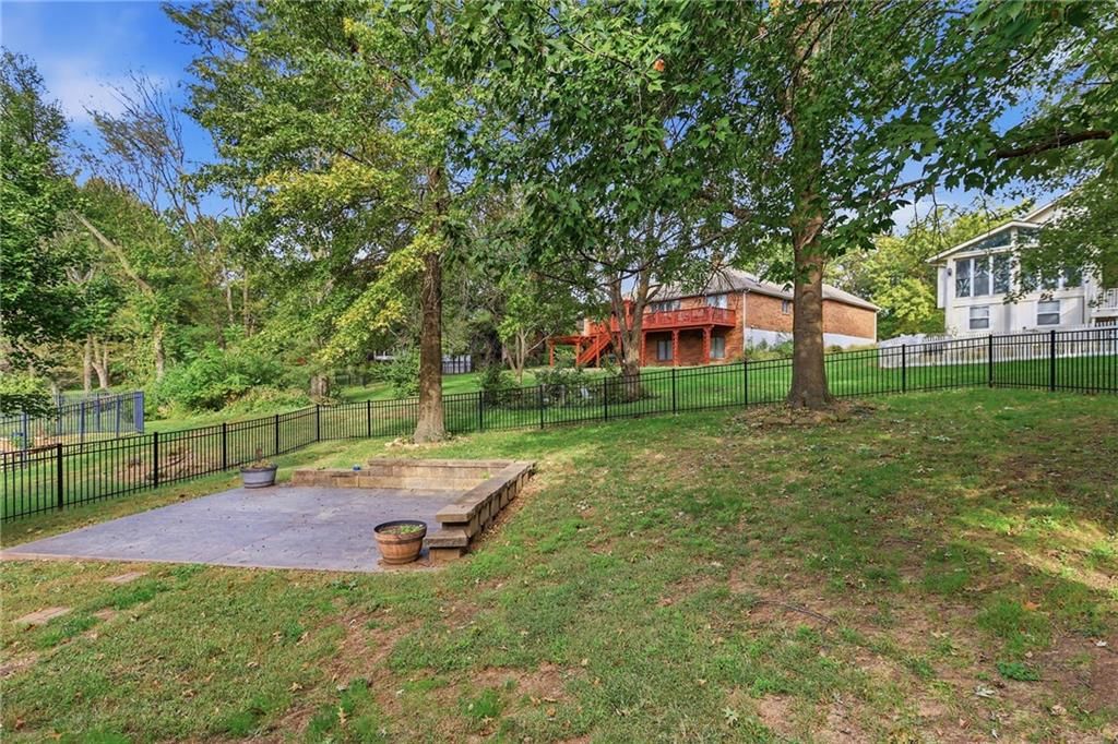 Big backyard and concrete patio at 17612 E 48th Terrace Court S, Independence, MO 64055