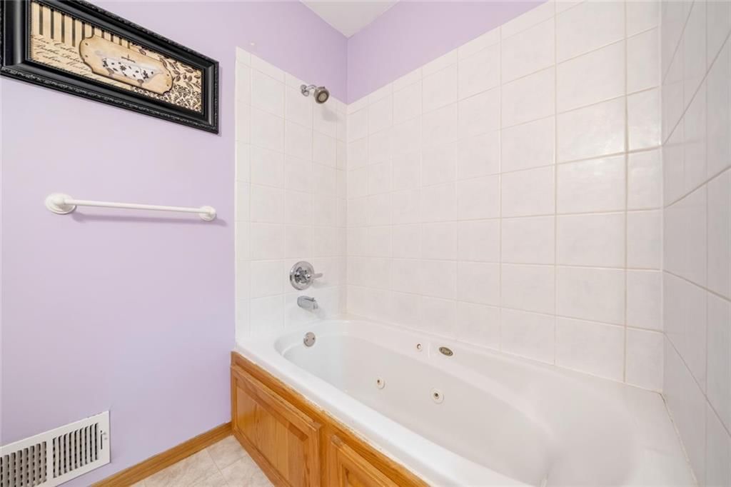 Tub and shower combo at 705 SW Mitchell Street, Oak Grove, MO 64075