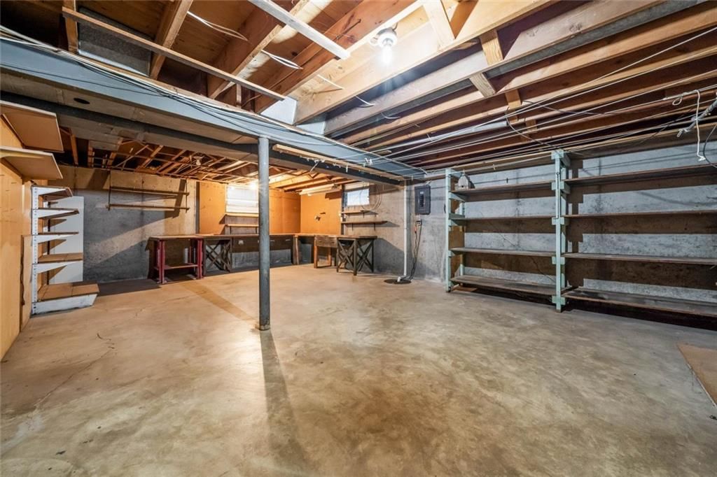 Garage storage system and attached garage at 705 SW Mitchell Street, Oak Grove, MO 64075