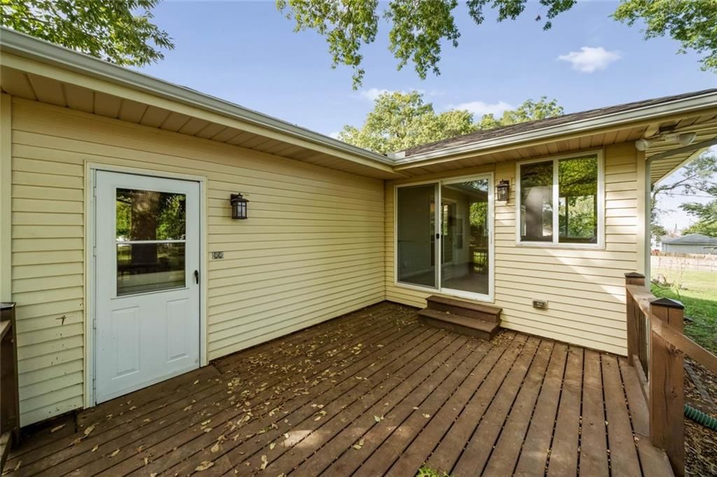 Deck, beige exterior and wood deck at 705 SW Mitchell Street, Oak Grove, MO 64075