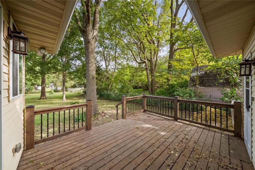 Mature trees and covered patio at 705 SW Mitchell Street, Oak Grove, MO 64075