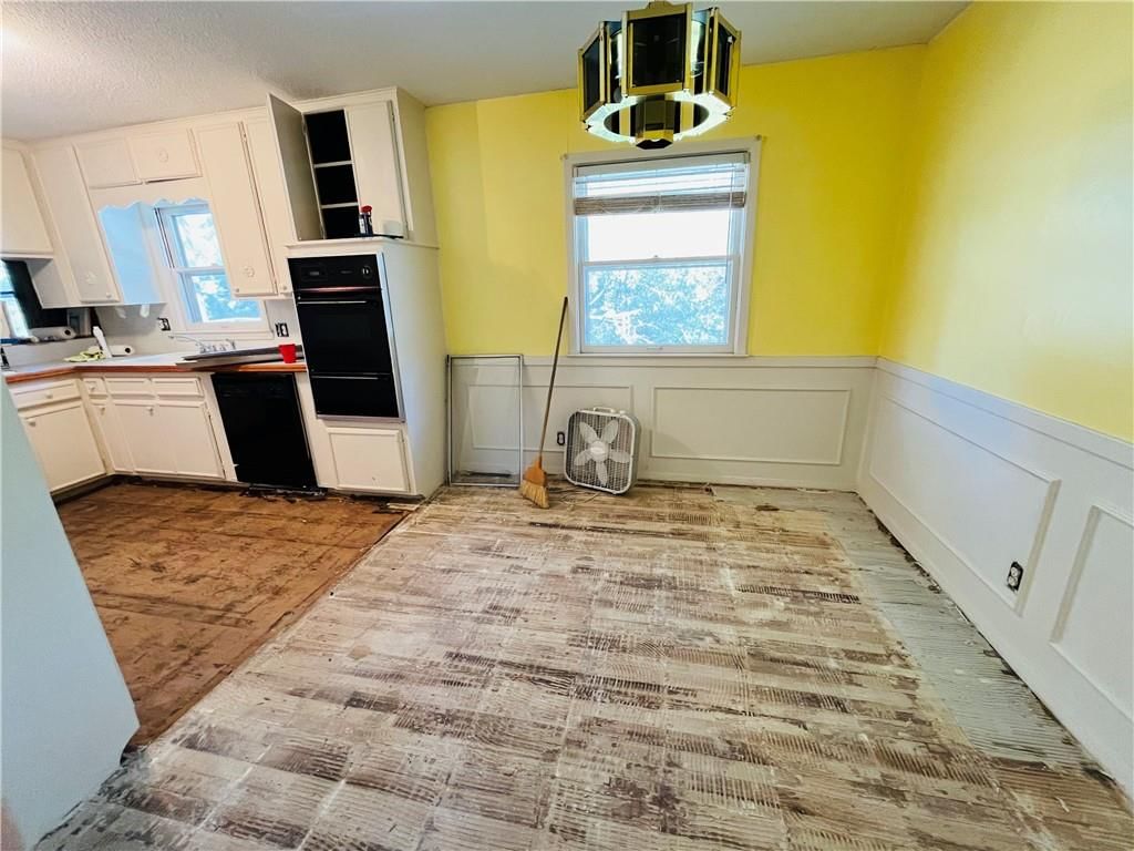 Wainscoting or board and batten and breakfast nook at 3829 Stonewall Court, Independence, MO 64055