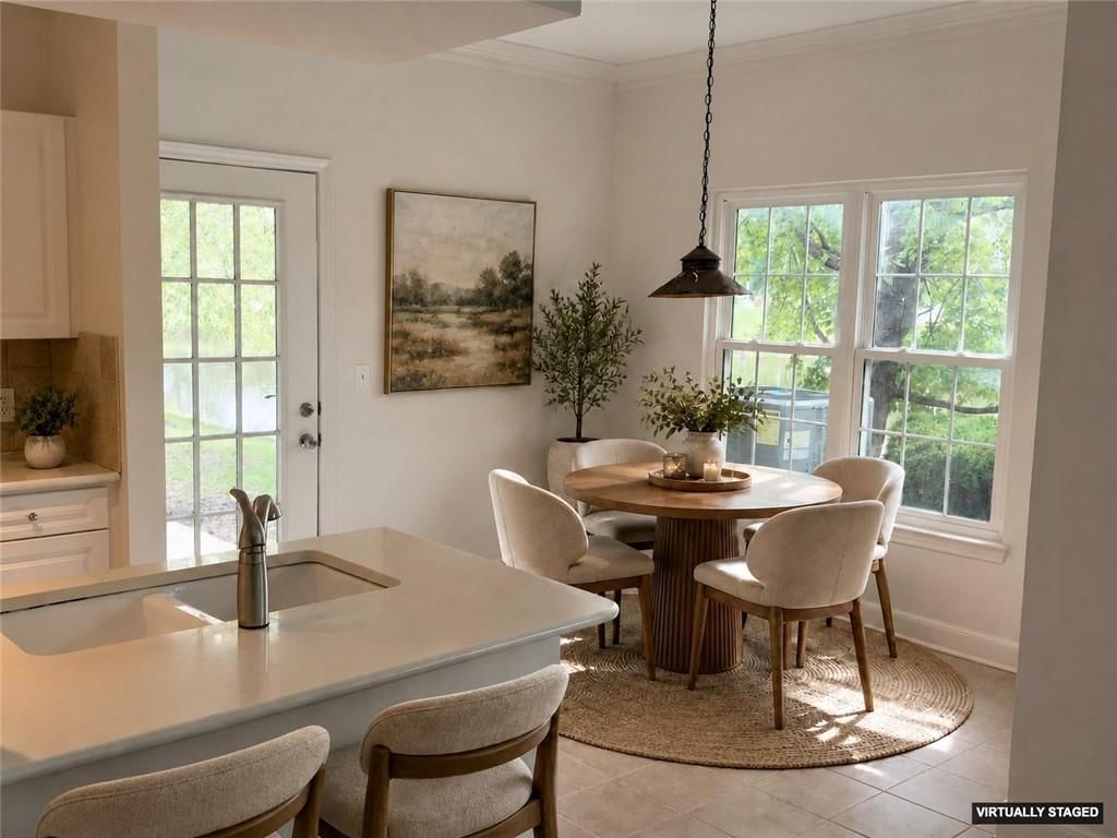 Quartz counters, shaker cabinets and breakfast nook at 11630 Tomahawk CreeK Parkway #J, Leawood, KS 66211