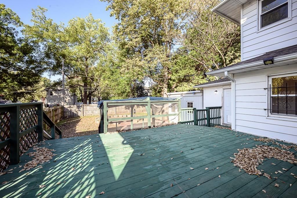 Deck, big backyard and fenced yard at 5828 Paseo Boulevard, Kansas City, MO 64110