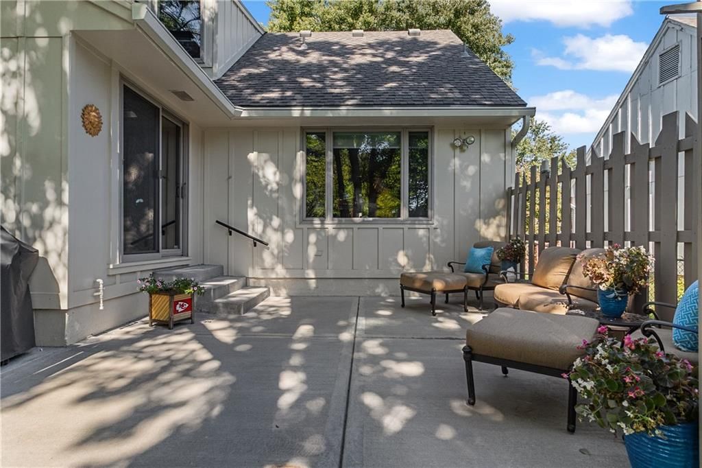 Fenced yard, covered patio and wood fence at 10909 W 102nd Street, Overland Park, KS 66214